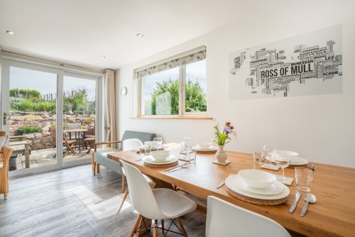 The lovely dining area at Maple Cottage with garden views