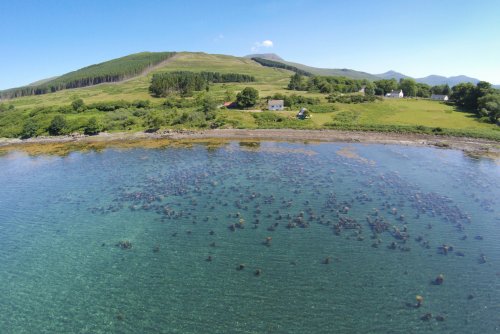 Settlement of cottages at Kilfinichen.  The Old Post Office seen here second property in from the right-hand side