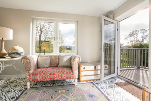 Throw open the doors from the sun room and marvel at the sea views
