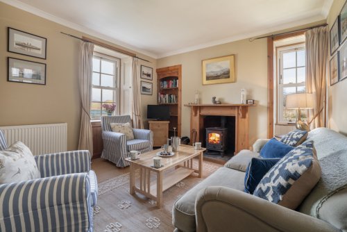 Cosy around the wood burning stove with charming sea views