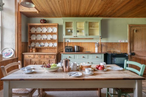 Sit in the country farmhouse kitchen at breakfast time