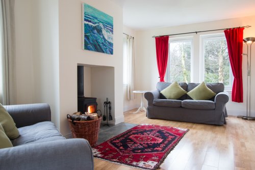 Living room at Puffin Cottage with woodburning stove