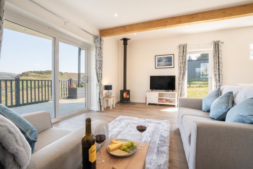Cosy up around the wood burning stove as you enjoy the sea and hill views