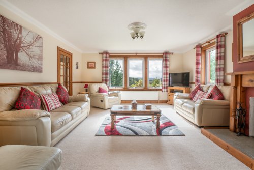 Settle into the spacious living room with far-reaching views
