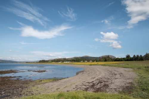 Wander the pebble beach just across the field from the cottage