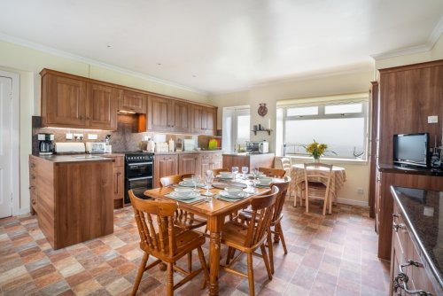 The bright and spacious dining kitchen with a stunning sea view