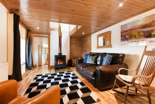 Sociable seating area by the wood burner in the kitchen