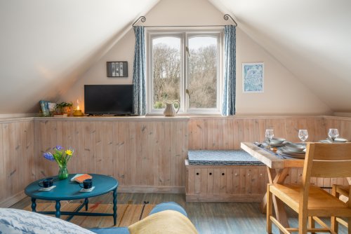 The vaulted ceiling creates a lovely airy feel