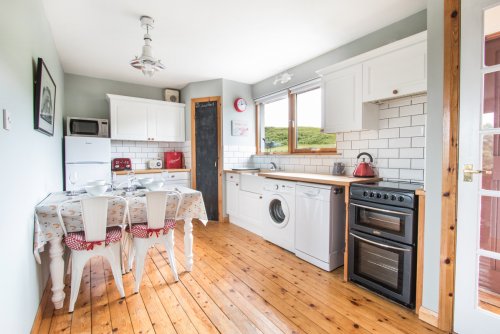 Fitted kitchen with table to seat four