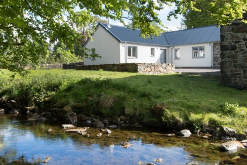 Beautiful setting with burn running beside the house