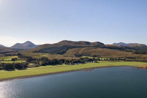 A bird's eye view of the airstrip and coastline in front of Tigh Bhan